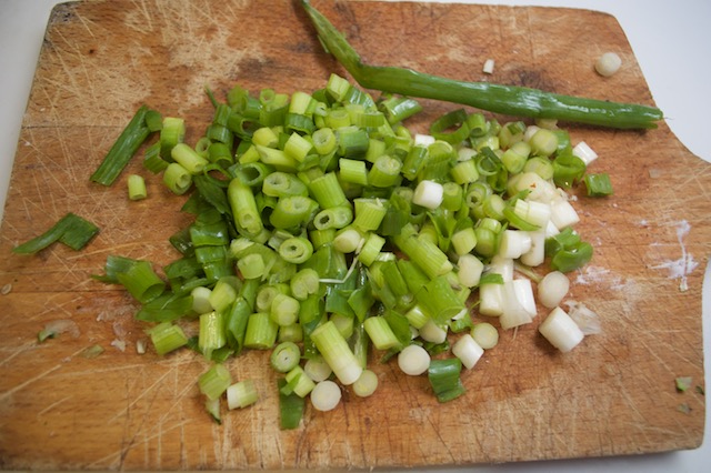 Chopped scallions for zucchini fennel fritters