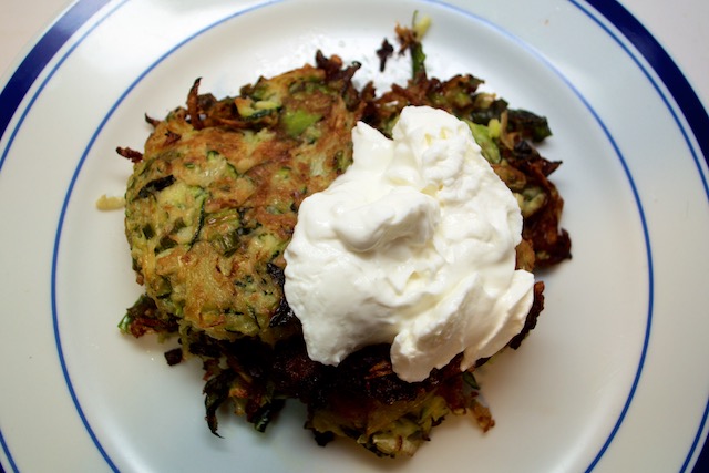 Zucchini fennel fritters topped with Greek yogurt