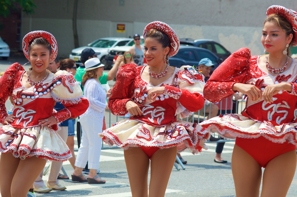 Dancers in Red along the Parade of the Silleteros route in Northern Boulevard in Jackson Heights, Queens for the Festival de las Flores