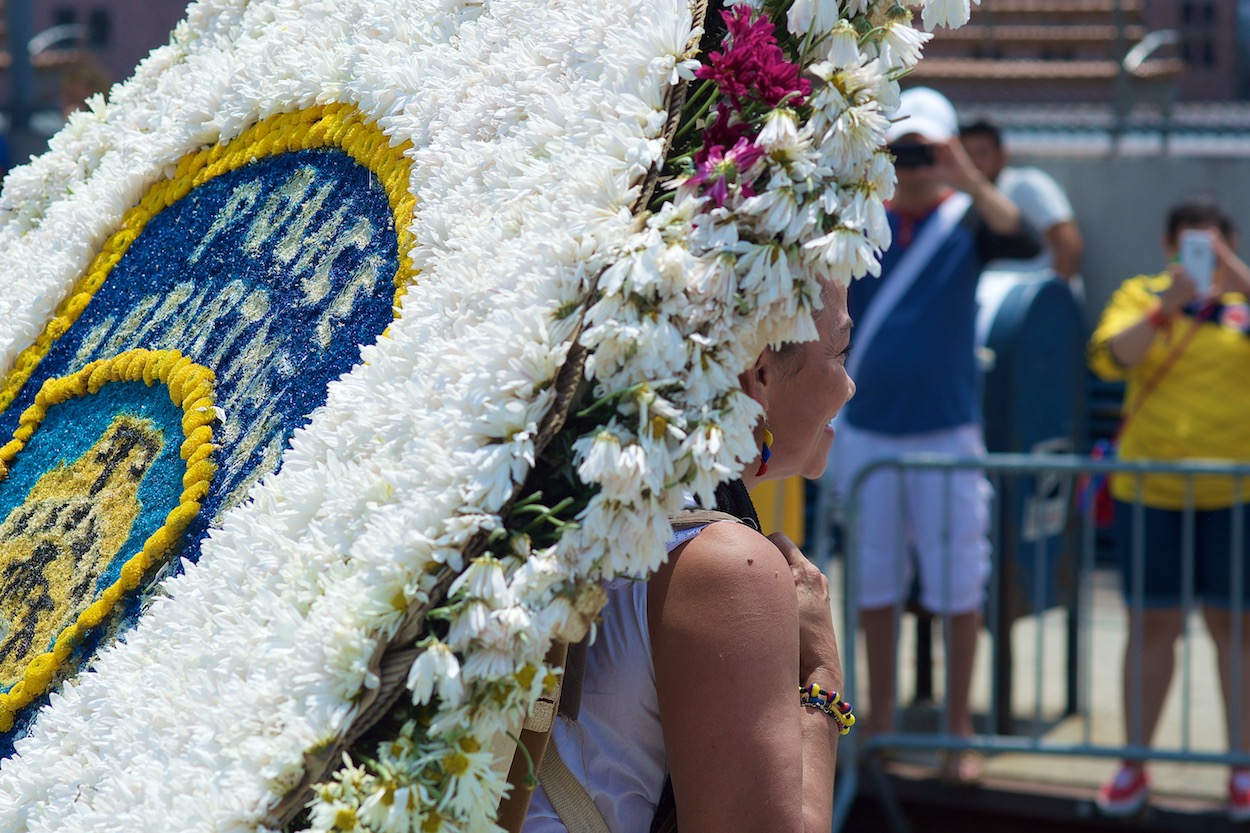 Silletero walking down Northern Boulevard in Jackson Heights, Queens for the Festival de las Flores/Parade of the Silleteros