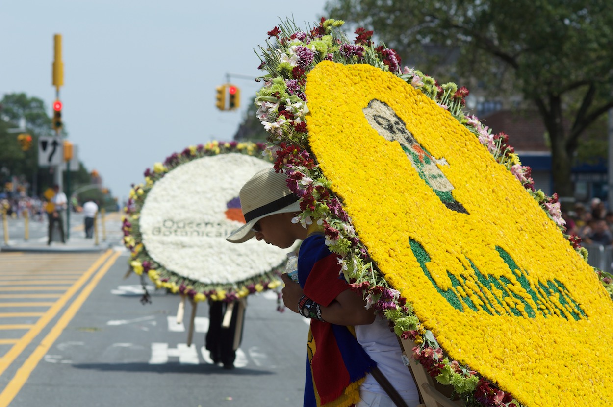 Silleteros walking down Northern Boulevard in Jackson Heights, Queens for the Festival de las Flores/Parade of the Silleteros