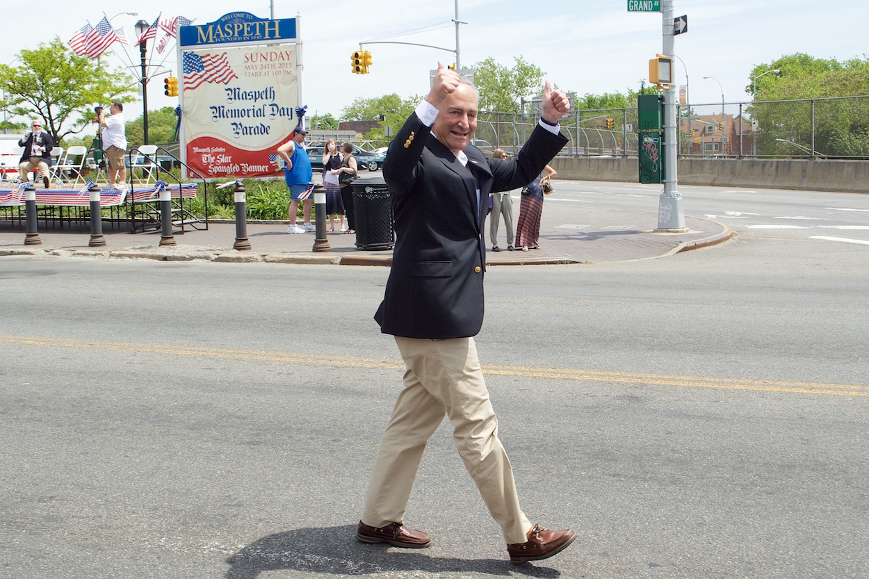 Senator Chuck Schumer walking in the
                     Maspeth Memorial Day parade