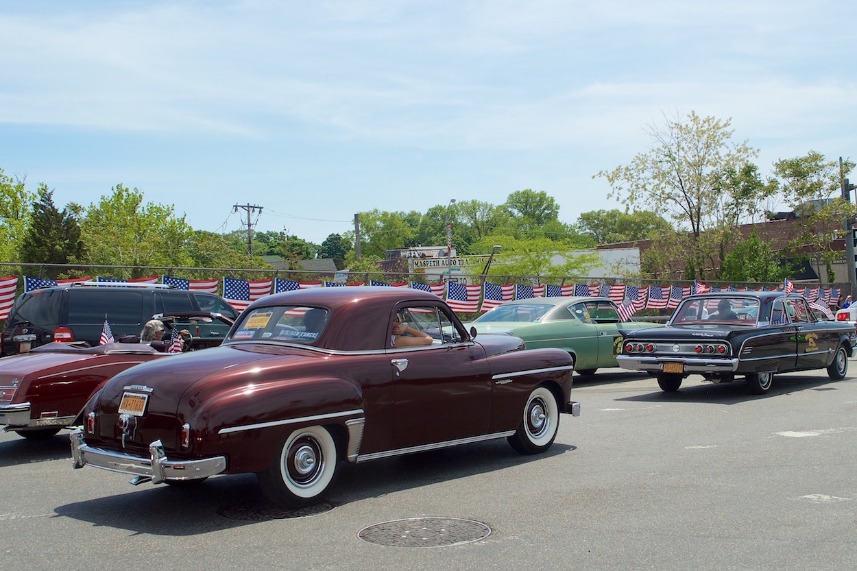 Vintage cars riding in the Maspeth
                     Memorial

                     Day parade