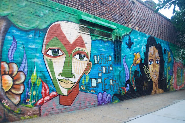 Define Your Dream street art mural along a wall in Sunnyside Queens