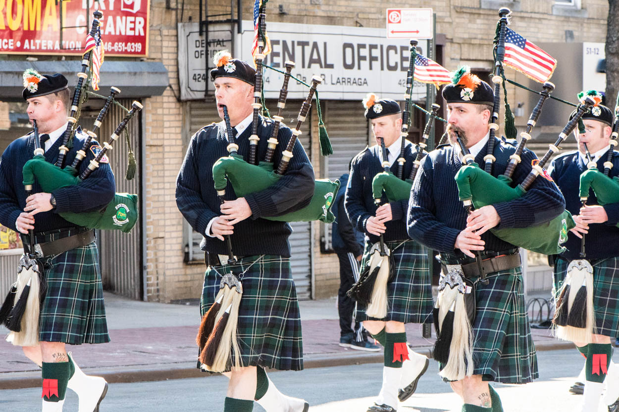 Bagpipe Players Marching in St. Pats for
            All Parade in Woodside, Queens