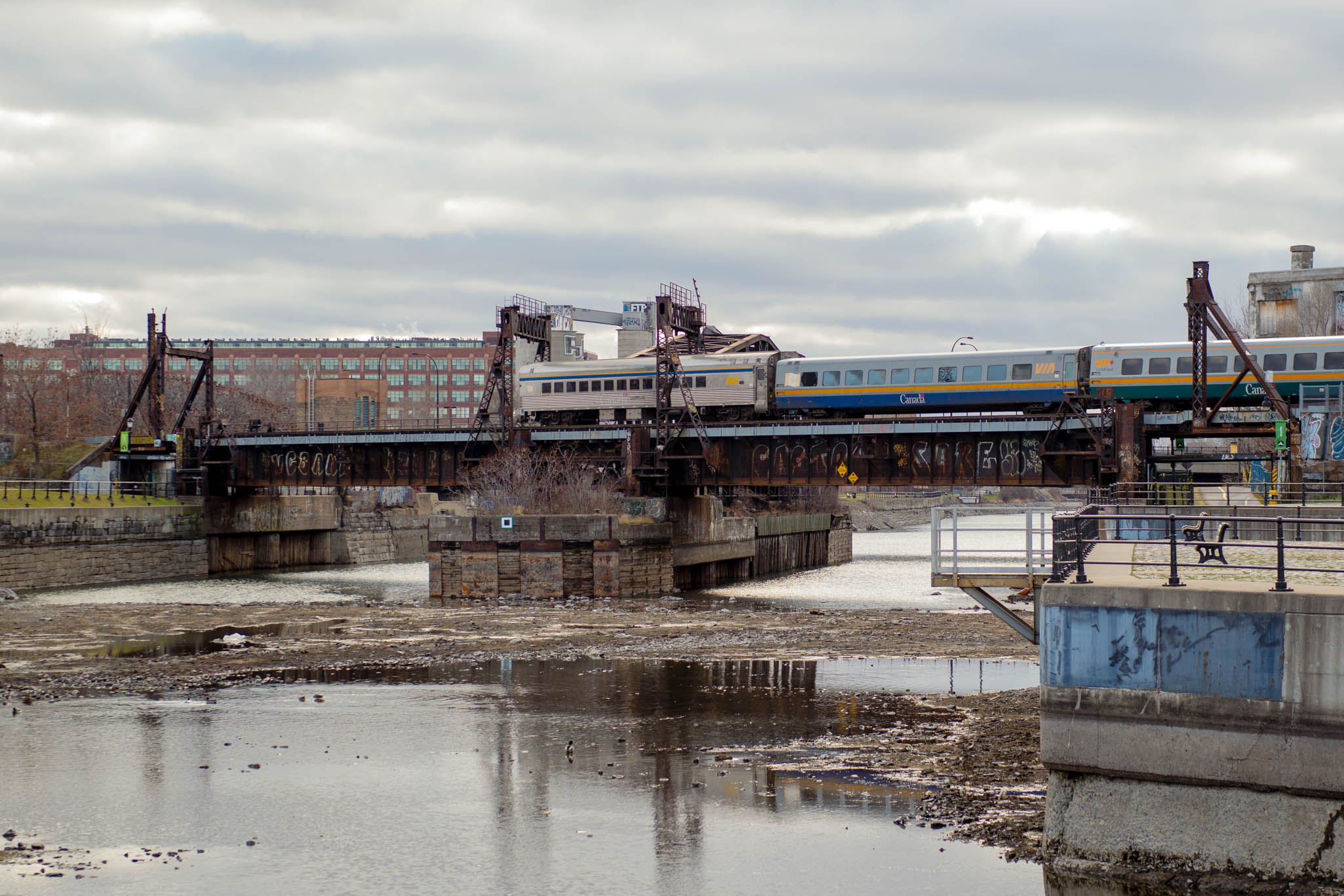 Train arriving along the Lachine Canal in Montreal, Canada