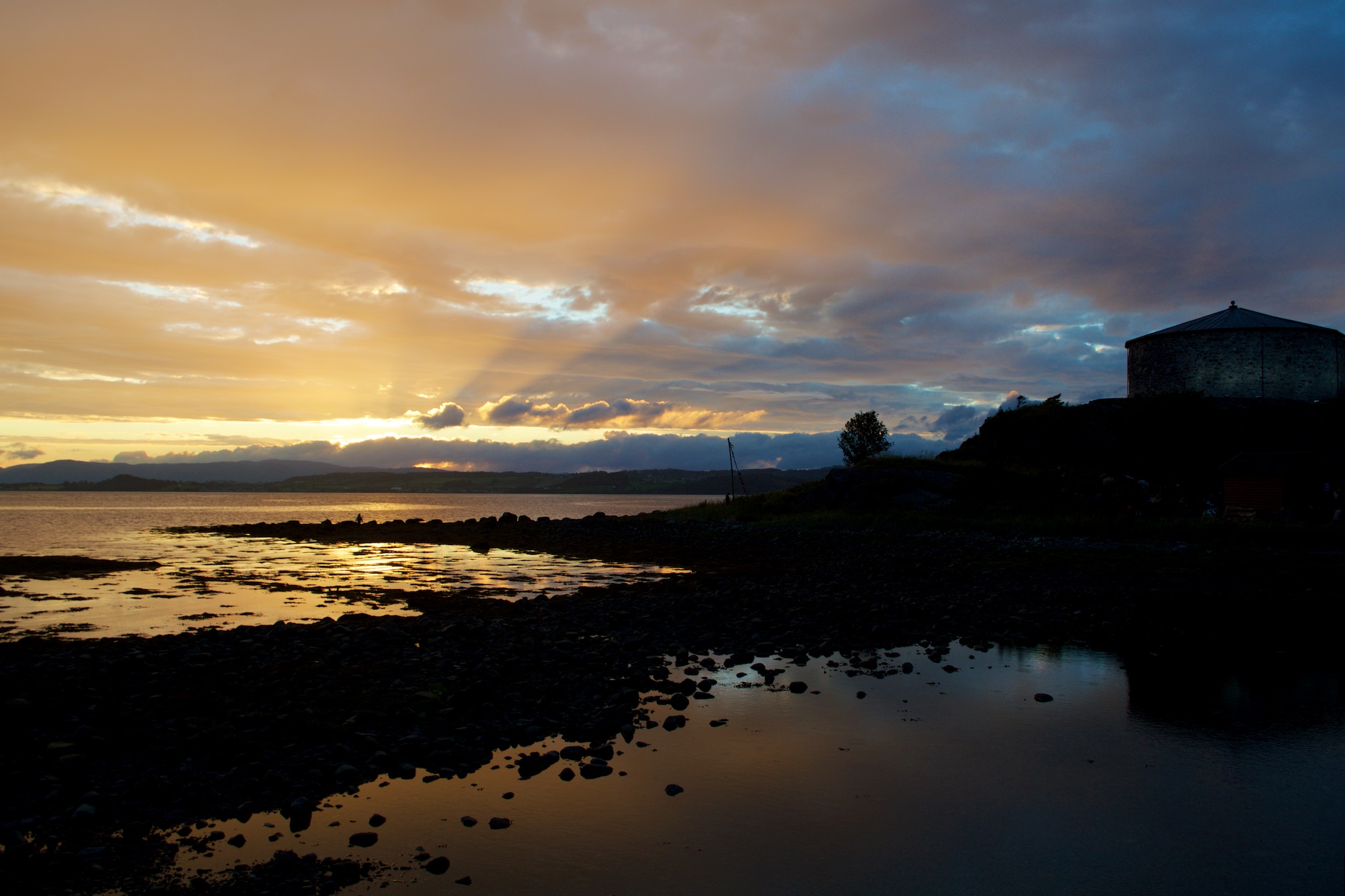 Sunset over the fjord and Steinvikholm Castle in Stjoerdal, Norway