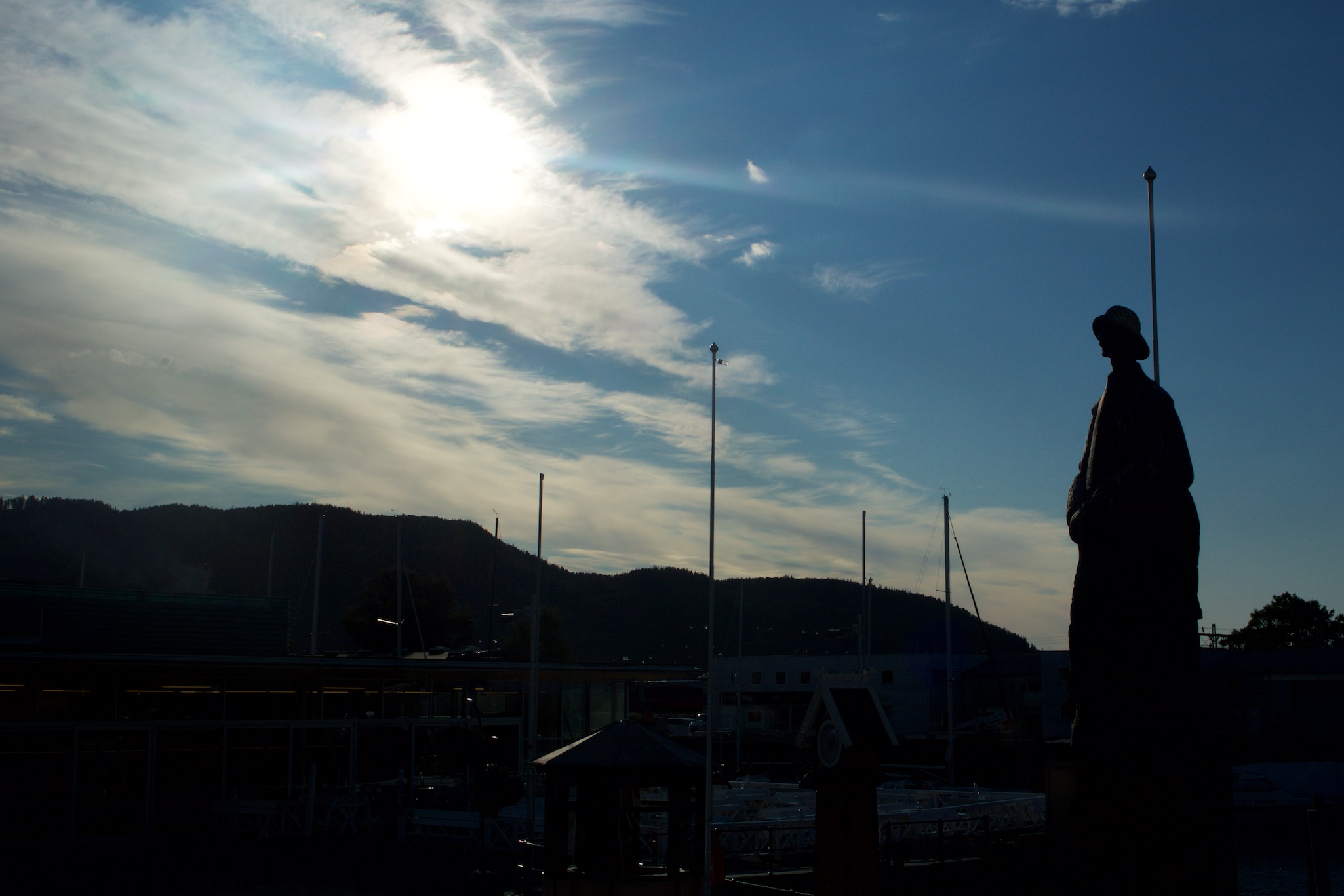 Sun setting behind The Last Viking Statue in Trondheim, Norway