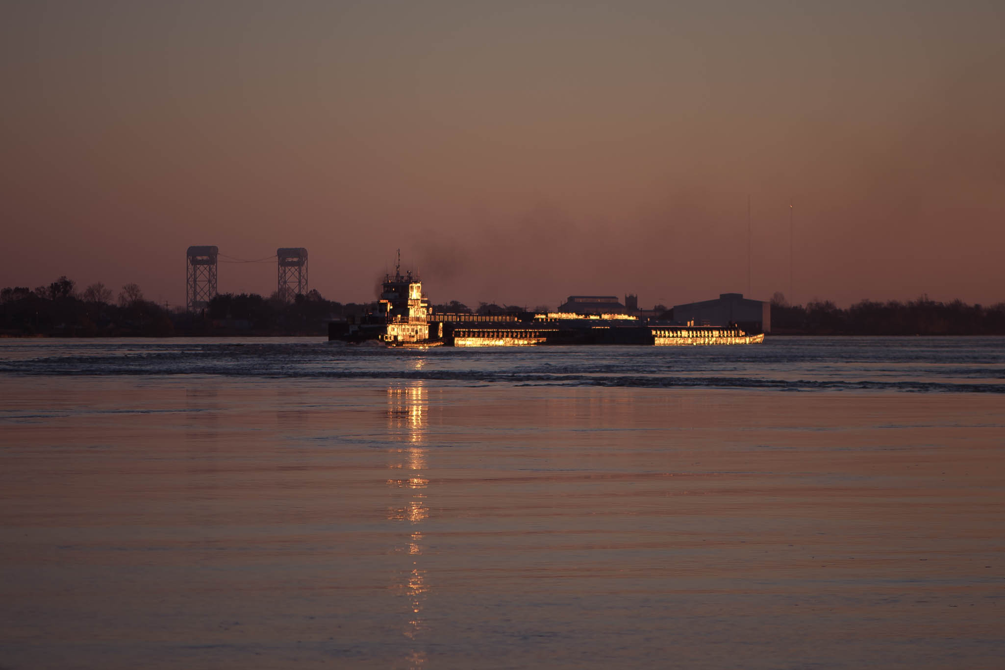 Sunrise and Boat on the Mississippi River in New Orleans, Louisiana, USA